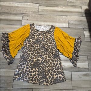 Leopard Print Top with Yellow Sleeves it’s a Medium but can fit a Large!